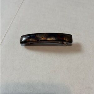 Brown Glossy Hair Clip with Decorative Pattern